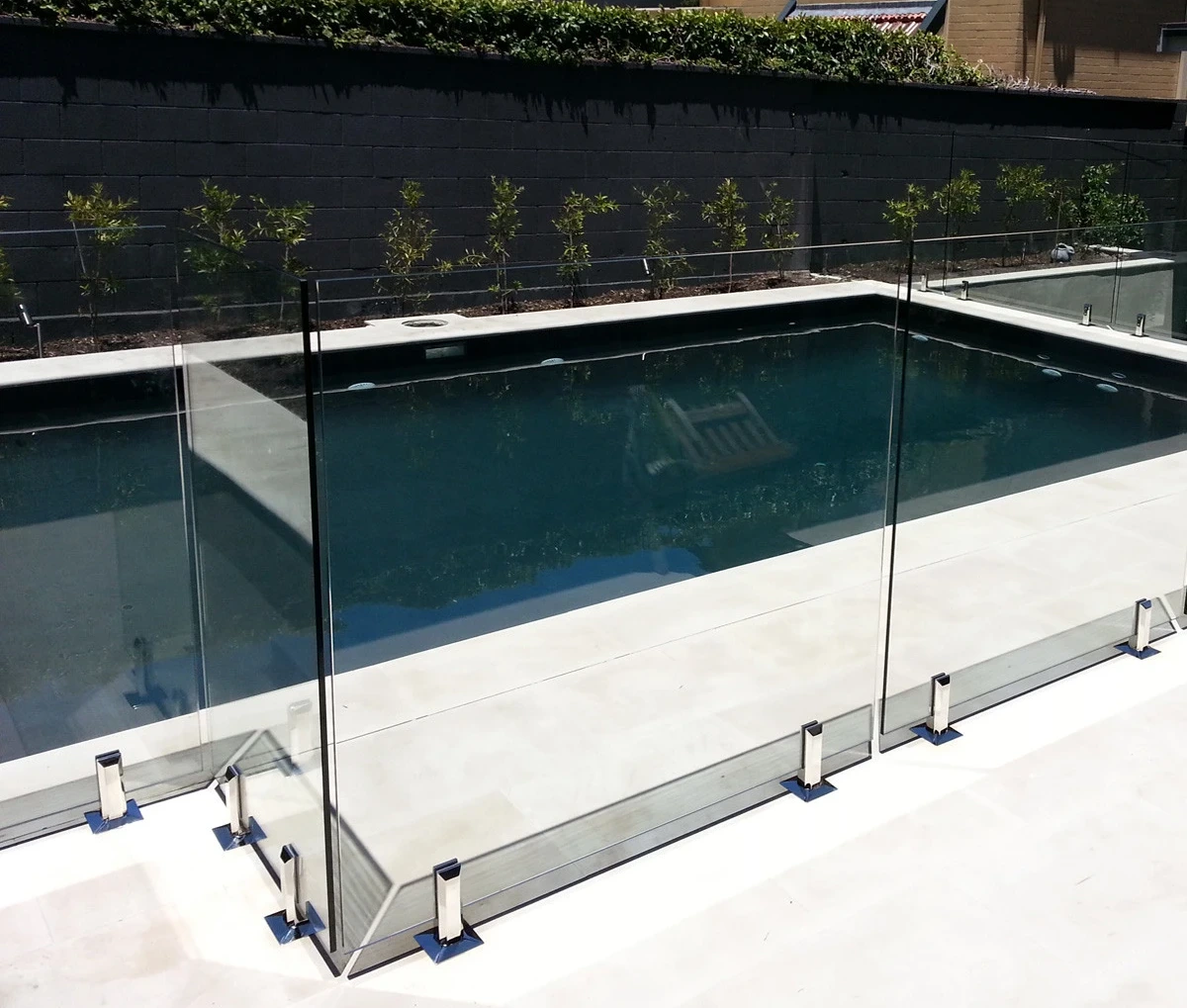 Pool fence installation detail showing durable posts and clean deck integration